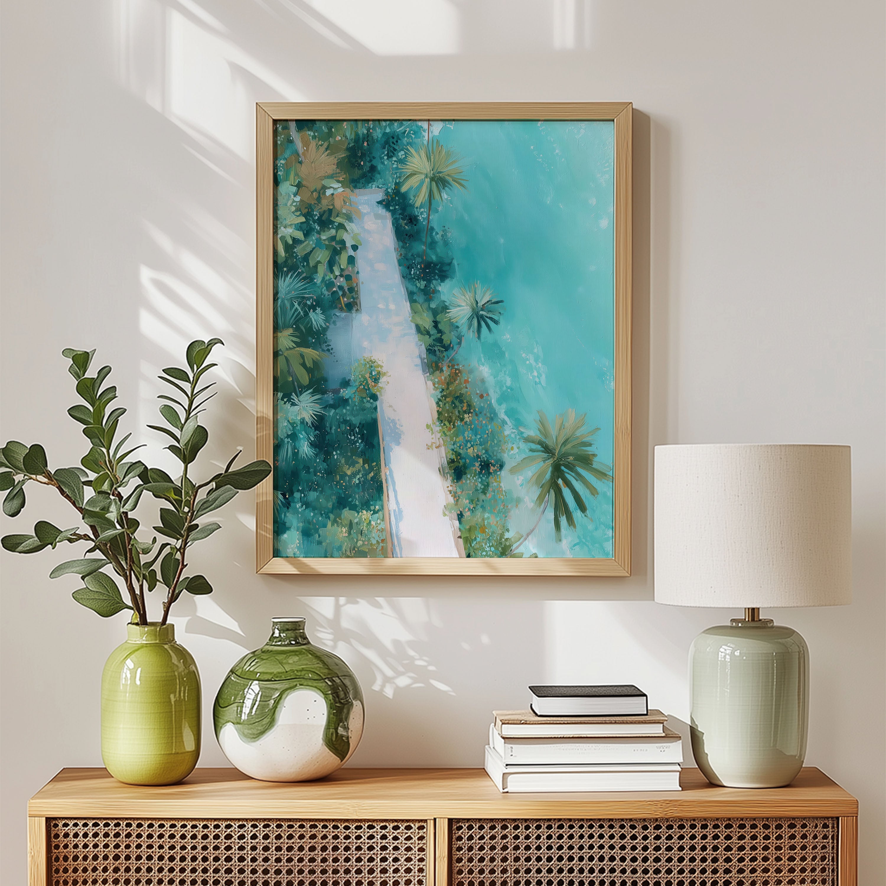Framed abstract artwork on a wall above a wooden console table with decorative items.