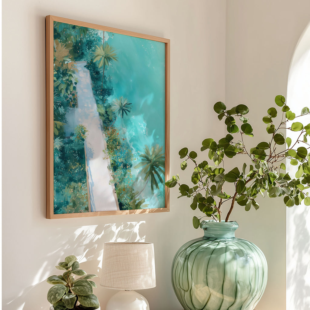 Framed artwork of a tropical landscape on a wall with a green vase and plant.